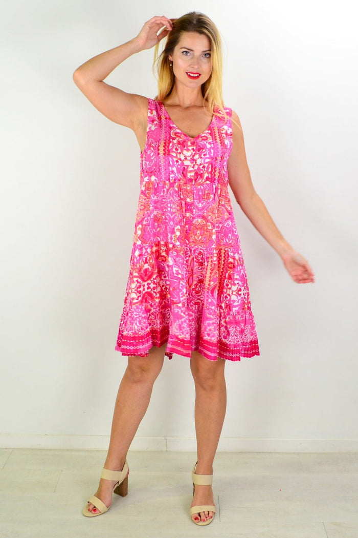 Orientique Kotor tiered tunic dress displayed on a hanger, featuring flowy fabric and layered design perfect for casual wear.