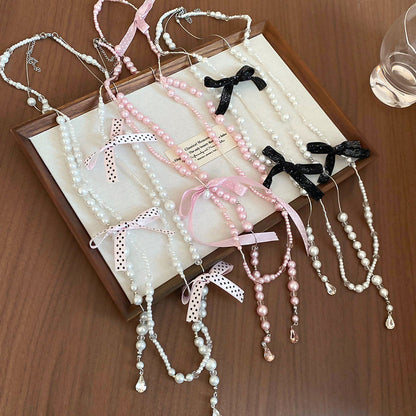 Chanel-inspired Butterfly-knot Necklace With A Sweet Long Design And Layered Pearl Accents - Fashionnsio