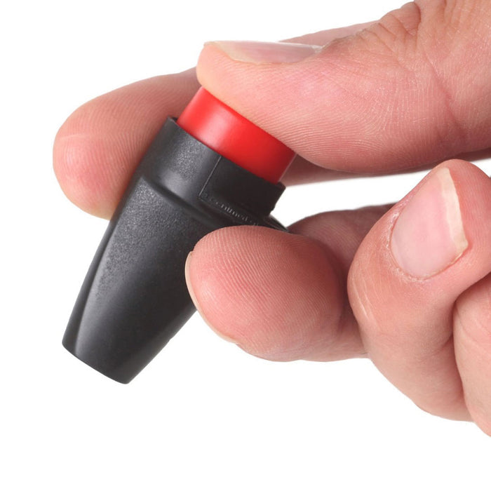 Lifesystems mini insect bite relief clicker being held in a persons hand and photographed on a white background