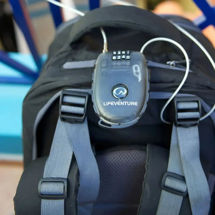 Lifeventure 4 Dial Combination Cable Lock securing a backpack to a bench