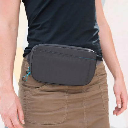 Lifestyle image of a woamn wearing a Lifeventure RFiD travel belt pouch around her waist