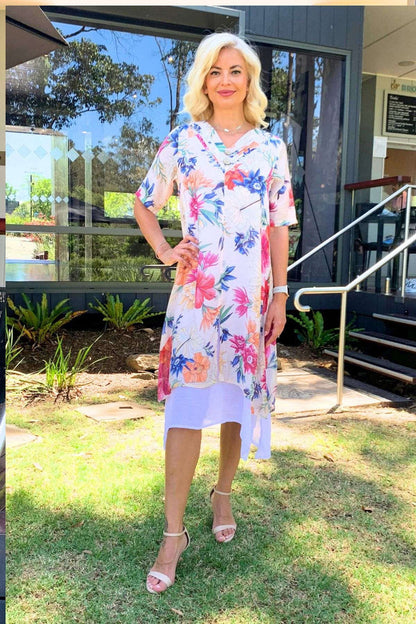 Light beige print summer tunic dress by La Mode featuring a relaxed fit and floral pattern, perfect for warm weather.