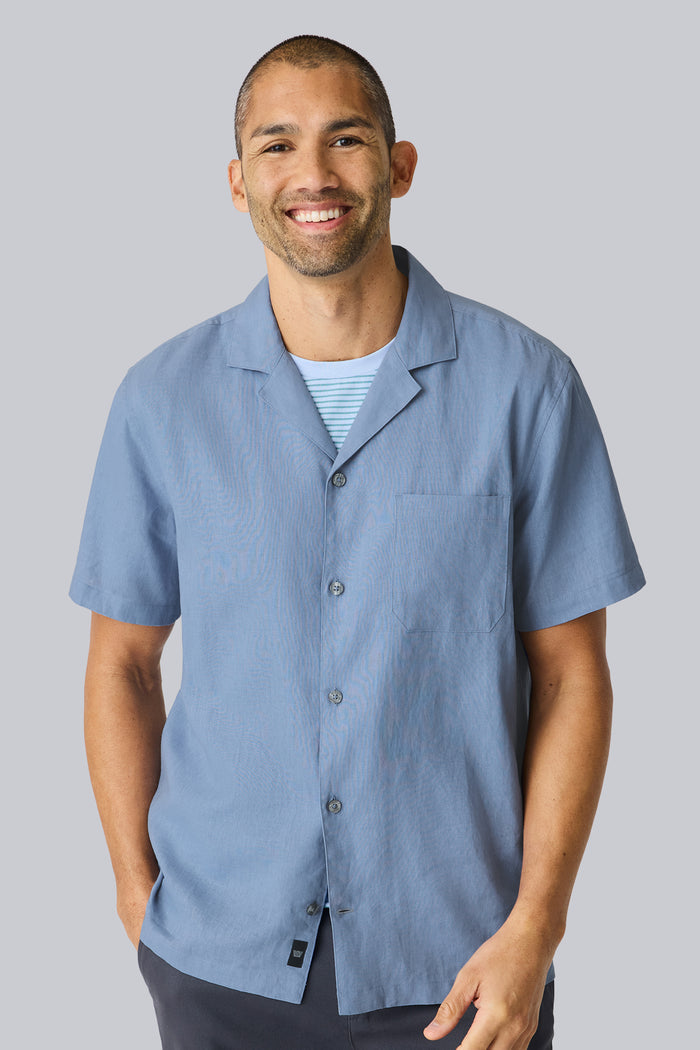 Front view of a man wearing Linen Camp Shirt in Desert Spring