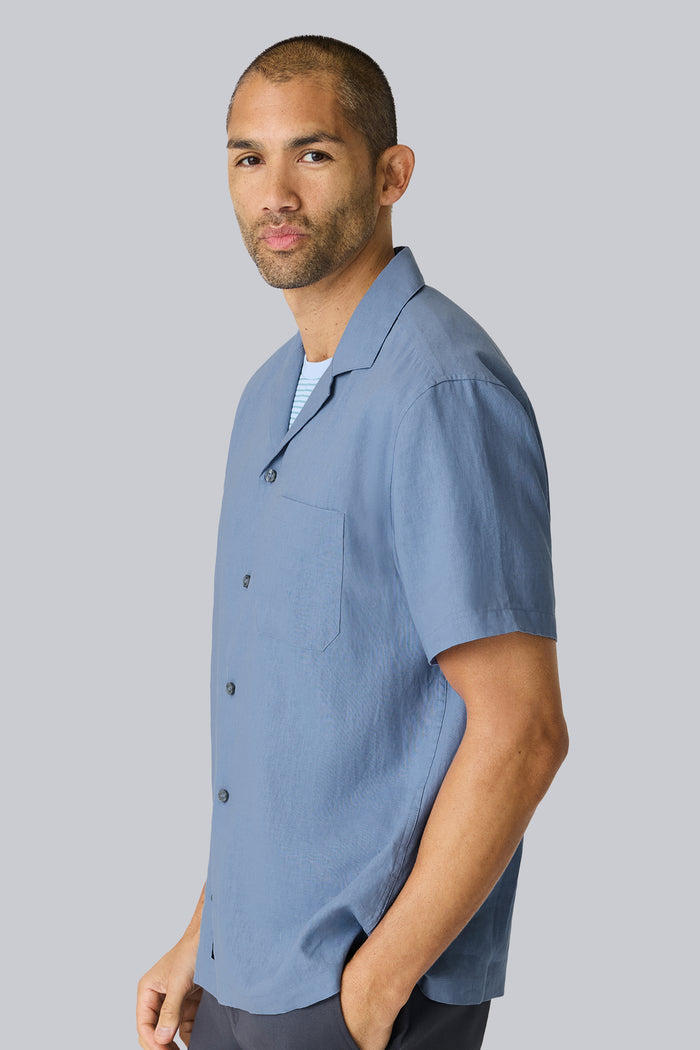 Side view of a man wearing Linen Camp Shirt in Desert Spring