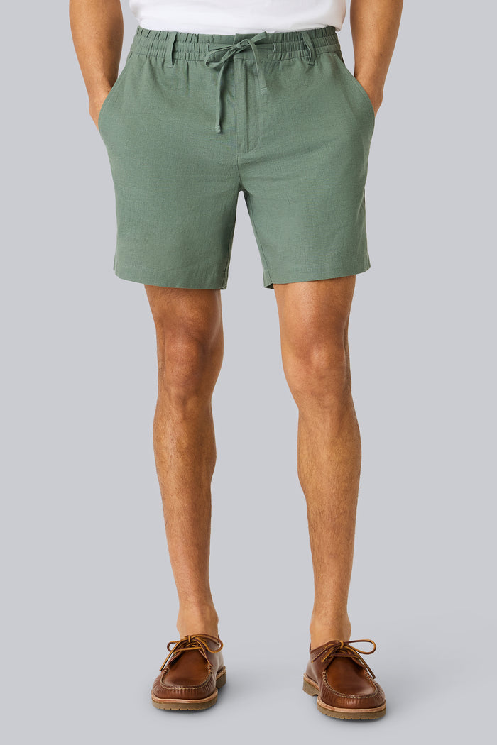 Front view of a man wearing Linen Drawstring Short in Cactus