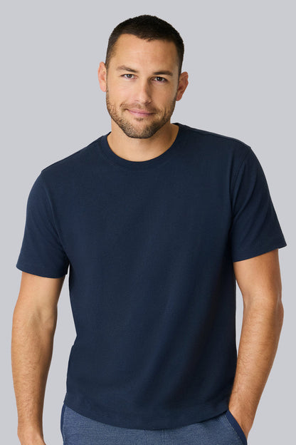 Front view of a man wearing Linen Jersey Crew Neck T-shirt in Total Eclipse