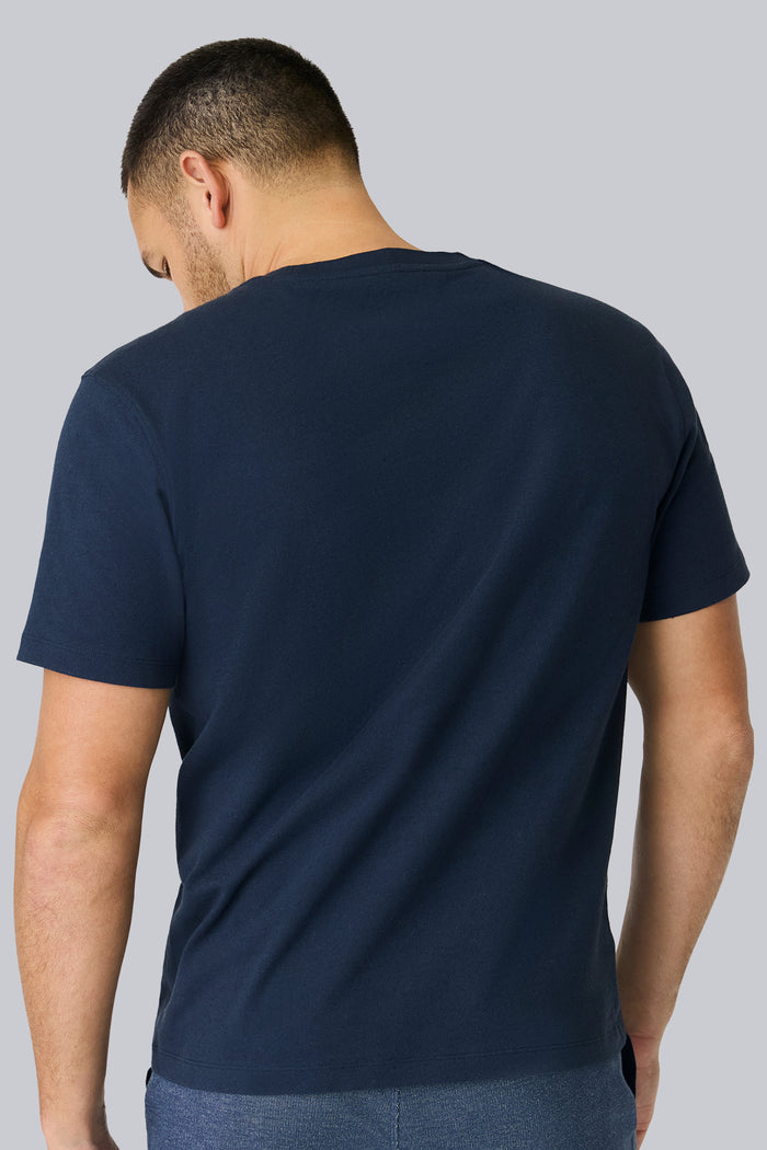Back view of a man wearing Linen Jersey Crew Neck T-shirt in Total Eclipse