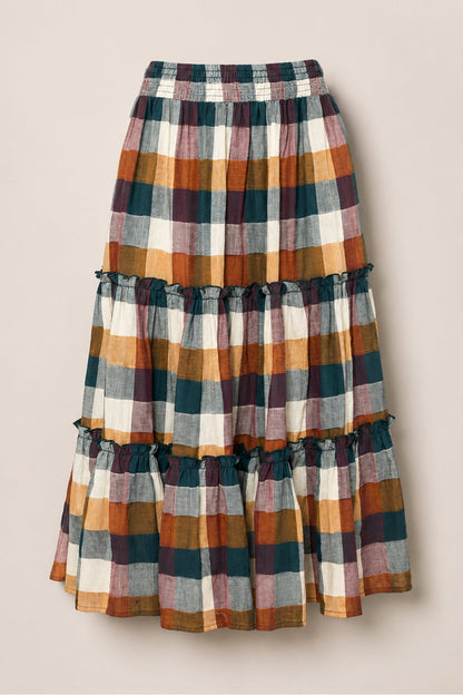 The Madeline Skirt in Maize Gingham by Ivy City Co features a long, tiered silhouette with ruffled seams, an elastic waistband, and convenient pockets. Crafted from a soft cotton-blend for all-day comfort, its plaid pattern combines shades of green, mustard yellow, rust, white, and mauve for a charming touch.