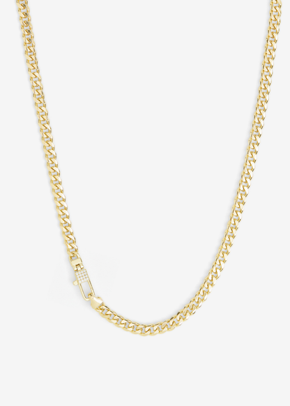 Gold chain necklace with a lock clasp and pave accents on a white background