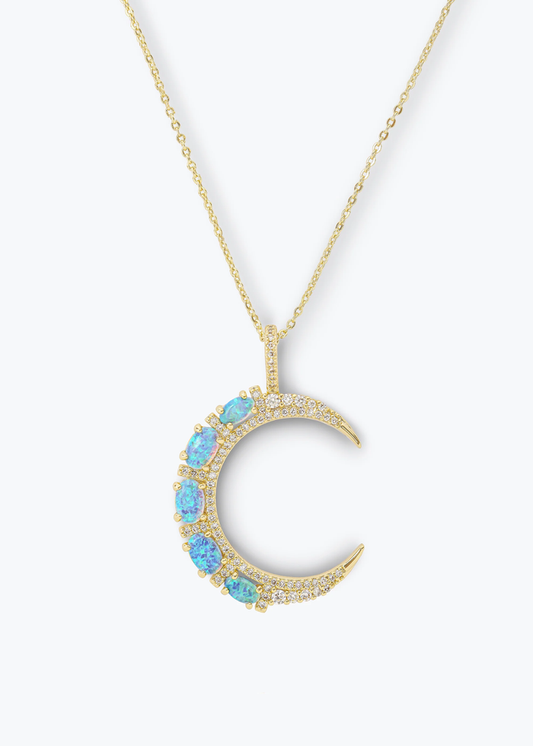 Gold necklace with a gold moon pendant with blue opal studs