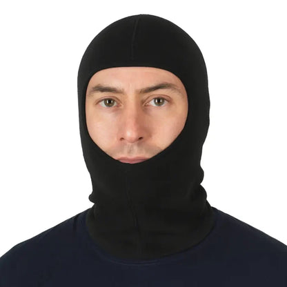 Head and shoulders shot of a man wearing a Sub Zero Meraklon thermal balaclava in black on a white background