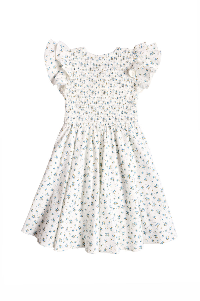 The Ivy City Co Mini Hattie Dress in Madeline Blue is a white short-sleeved dress featuring a smocked bodice, ruffled sleeves, flared skirt, and blue-green floral print—ideal for coordinated mommy-and-me style.