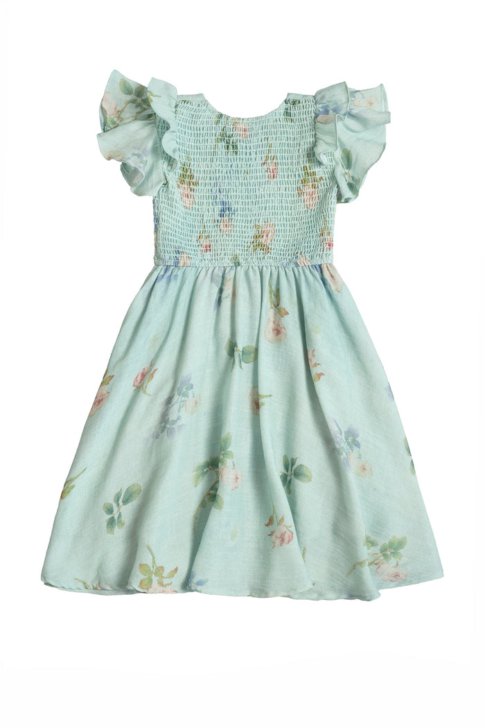 The Mini Hattie Dress in Roselyn Blue by Ivy City Co is a soft cotton-linen dress for young children, featuring short ruffled sleeves, a smocked bodice, flared skirt, and delicate pastel floral print for added charm.