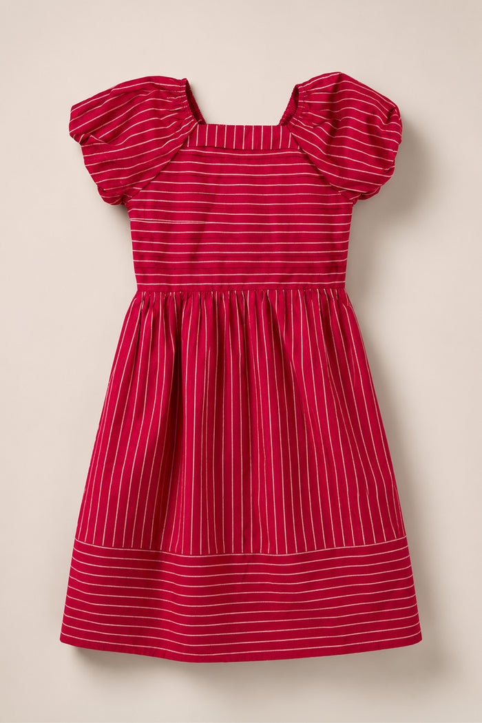 Mini Julie Dress in Cranberry Pinstripe by Ivy City Co, featuring white horizontal stripes, puff sleeves, a square neckline, smocked bodice, and gathered waist. The dress is laid flat on a light beige background.