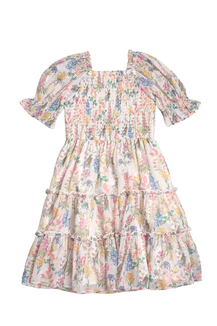 The Mini Madeline Dress in Cordelia Floral by Ivy City Co features a pastel floral print on white, short puff sleeves, smocked bodice, and tiered skirt—ideal for a girl's birthday dress.