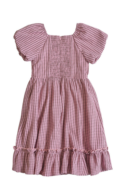 The Mini Monica Dress in Pink & Brown Gingham by Ivy City Co features a smocked bodice, puffed sleeves, ruffled hem, square neckline, gathered skirt, and a relaxed, lightweight fit for girls.