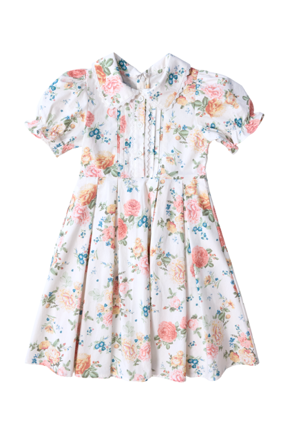 The Mini Sophia Dress in Countryside Peony Blossom by Ivy City Co is an ivory floral girls’ spring dress with pink, blue, and green blooms, short sleeves, pleated front, buttons, Peter Pan collar, fitted waist, and a full gathered skirt.