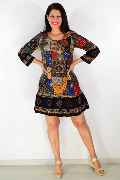 Moroccan mosaic tunic dress by Hourglass featuring vibrant, intricate patterns and flowing fabric, perfect for casual or boho style.