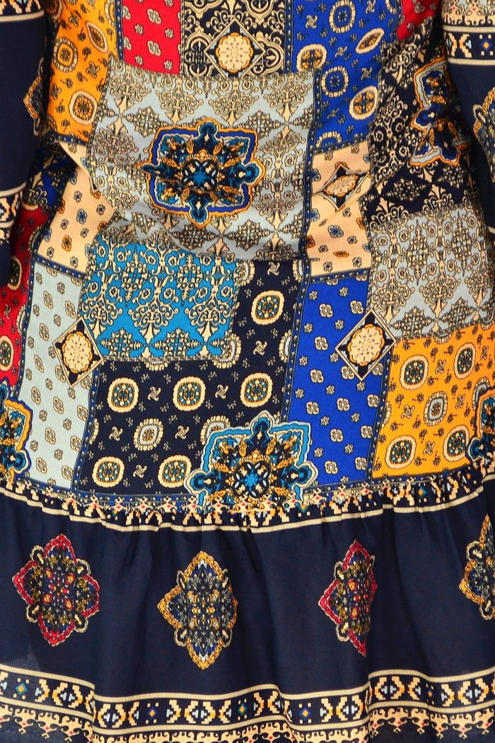 Colorful mosaic Moroccan tunic dress by Hourglass featuring intricate patterns and flowing fabric, perfect for casual or bohemian style.