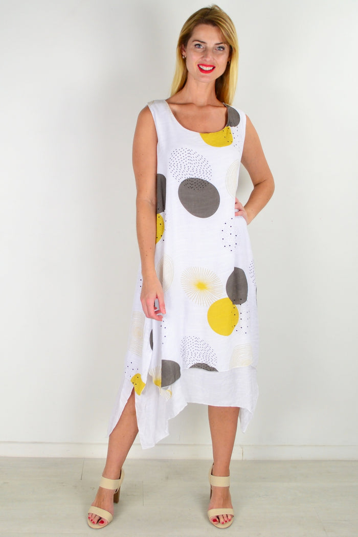 Mustard spot sleeveless tunic dress by La Mode, featuring a relaxed fit and stylish design, displayed on a hanger.
