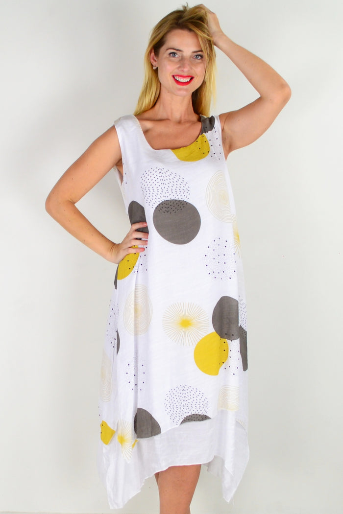 Mustard spot sleeveless tunic dress by La Mode featuring a relaxed fit and stylish design, shown on a hanger.