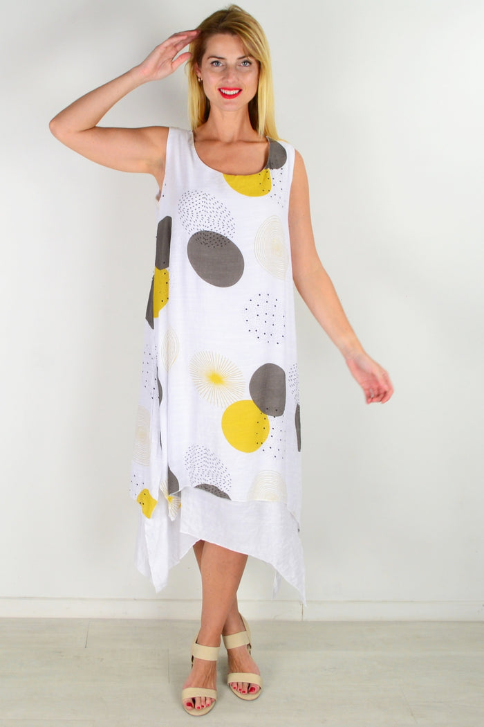 Mustard spot sleeveless tunic dress by La Mode, featuring a relaxed fit and stylish design, shown on a hanger.