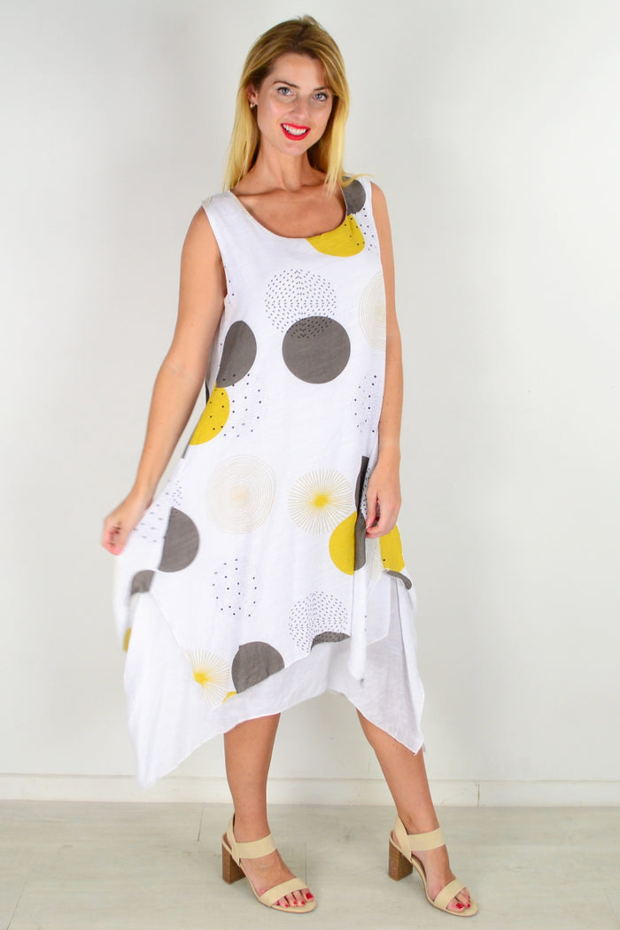 Mustard spot sleeveless tunic dress from La Mode featuring a relaxed fit and stylish design, displayed on a hanger.