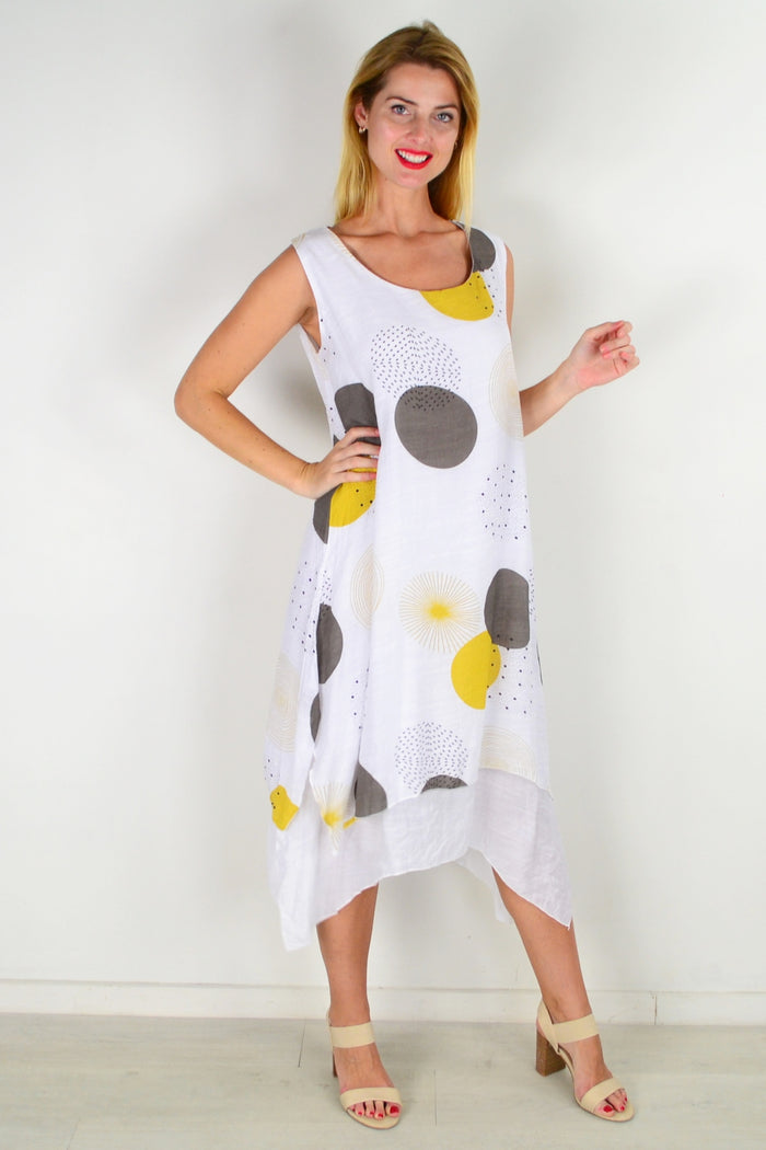 Mustard spot sleeveless tunic dress by La Mode, featuring a relaxed fit and stylish design, displayed on a hanger.