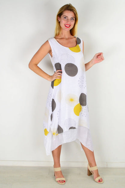 Mustard spot sleeveless tunic dress by La Mode, featuring a relaxed fit and stylish design, displayed on a hanger.