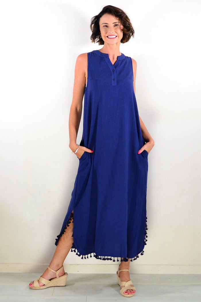 Navy sleeveless maxi dress tunic by Willow Tree with flowing fabric and a relaxed fit, displayed hanging on a wooden hanger.