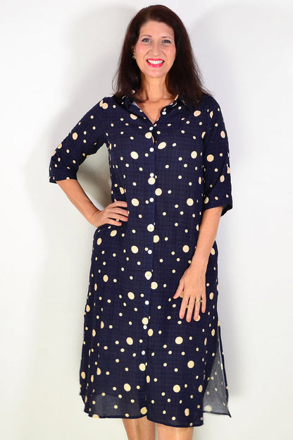 Navy spotted long tunic shirt by La Mode, with a relaxed fit and button-front design, displayed on a hanger.