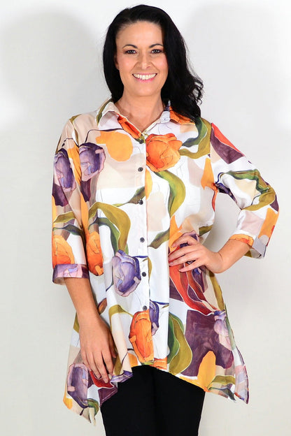 Orange artwork swirls tunic shirt by Wishstone featuring vibrant abstract patterns and a relaxed fit.
