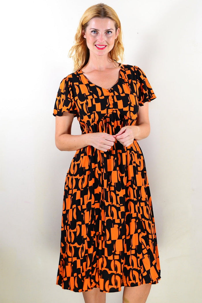 Orange and black printed tunic dress by Hourglass, featuring a stylish and comfortable design with a flowing silhouette.
