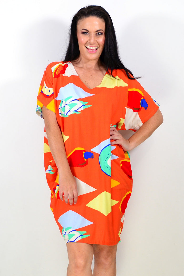 Orange Candy Lane tunic dress by Red Lotus, featuring a relaxed fit with long sleeves and a vibrant, playful design.