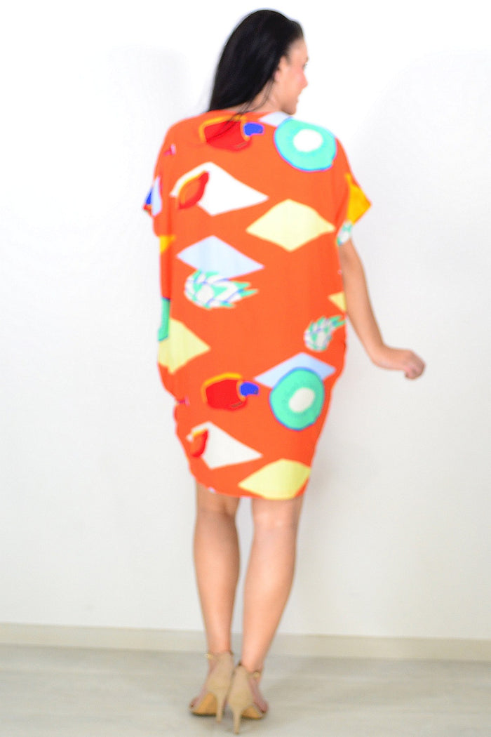 Orange Candy Lane tunic dress by Red Lotus, featuring a relaxed fit and vibrant color, displayed on a hanger.