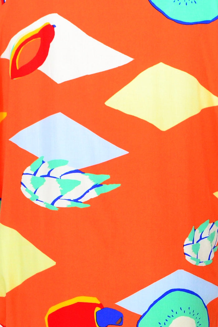 Red Lotus Orange Candy Lane Tunic Dress displayed on a hanger, showcasing its vibrant color and stylish design.