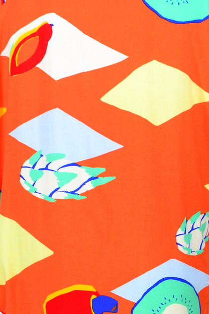 Red Lotus Orange Candy Lane Tunic Dress displayed on a hanger, showcasing its vibrant color and stylish design.
