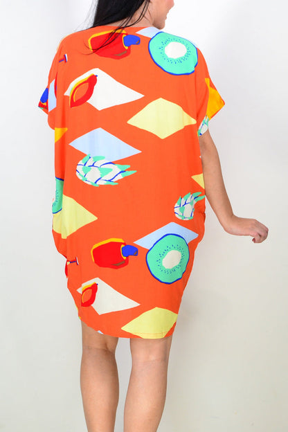 Orange Candy Lane tunic dress by Red Lotus, shown hanging on a mannequin with a relaxed fit and vibrant color.