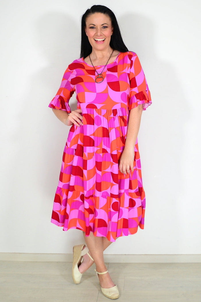 Orange and purple geometric midi tunic dress by New U Collection featuring a stylish, modern design and comfortable fit.