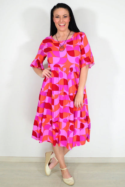 Orange and purple geometric midi tunic dress by New U Collection featuring a stylish, modern design and comfortable fit.