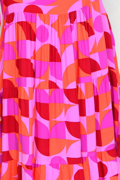Orange and purple geometric midi dress by New U Collection, stylish tunic with bold patterns and a modern silhouette.
