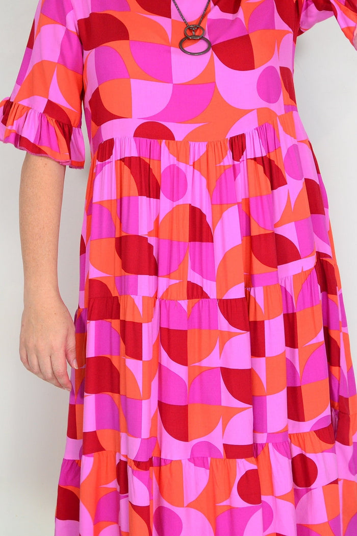 Orange and purple geometric midi dress from New U Collection, stylish tunic with bold pattern and modern design.