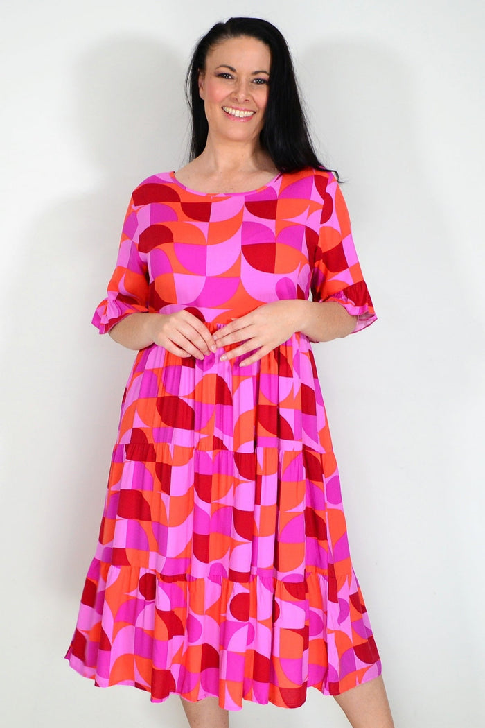 Orange and purple geometric midi dress from New U Collection, stylish tunic with bold patterns and a flattering fit.