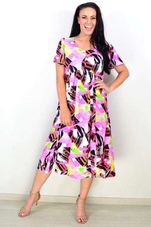 Pink and black abstract tunic dress by Hourglass, featuring a stylish flowy design and modern artistic pattern.