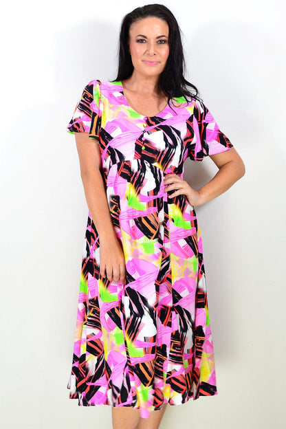 Pink and black abstract tunic dress by Hourglass featuring a flowing fabric and stylish design, shown on a model.