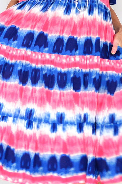 Pink and blue tie dye tunic dress by Hourglass featuring a relaxed fit and vibrant pattern, displayed on a hanger.