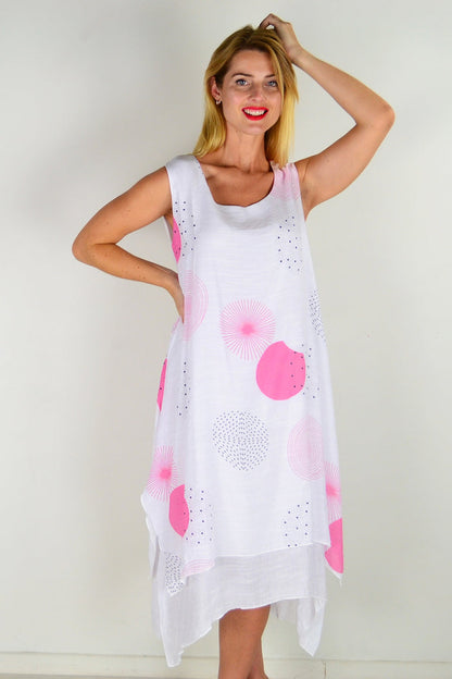 Pink spot sleeveless tunic dress by La Mode, featuring a relaxed fit, round neckline, and playful polka dot pattern.