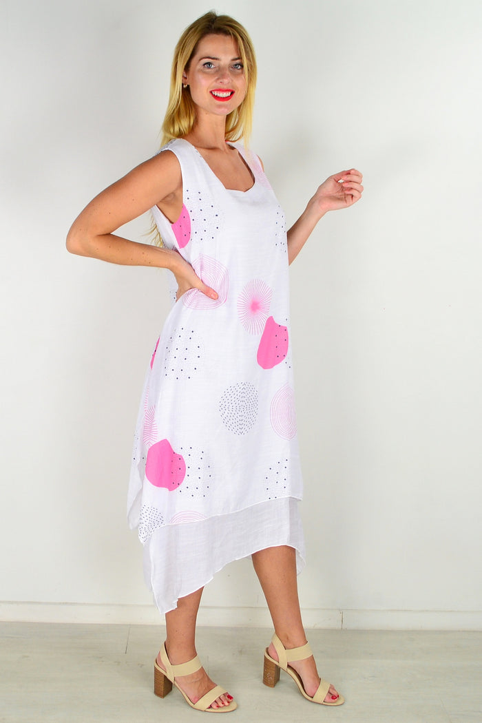 Pink spot sleeveless tunic dress by La Mode, featuring a flowy fabric and sleeveless design, displayed on a hanger.
