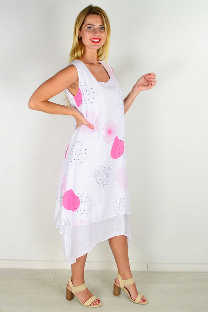 Pink spot sleeveless tunic dress by La Mode, featuring a flowy fabric and sleeveless design, displayed on a hanger.
