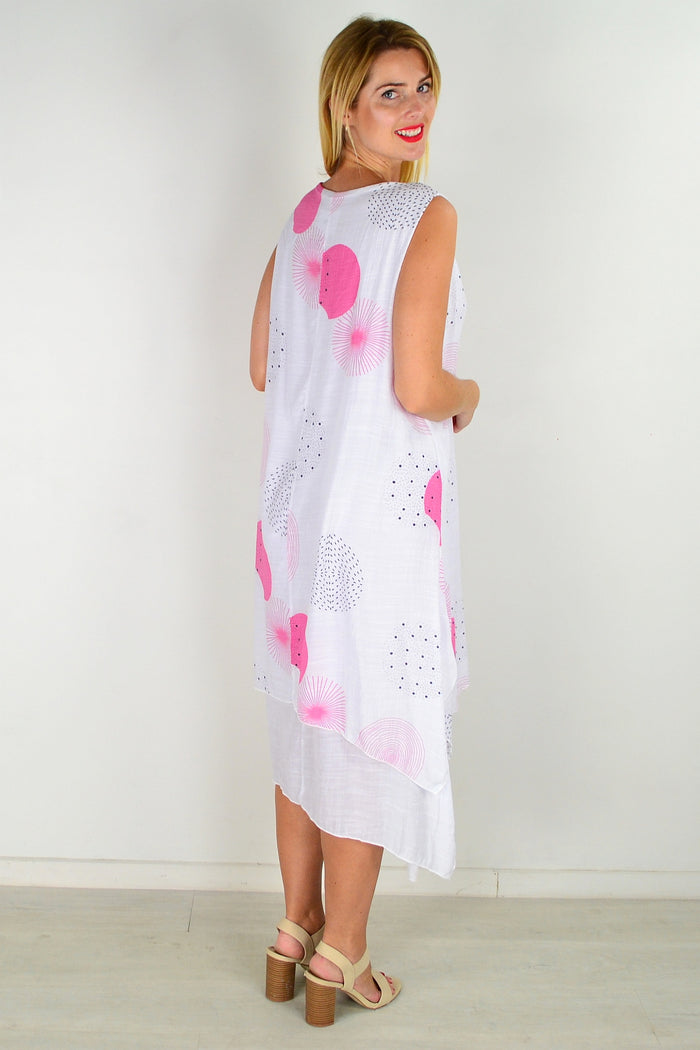 Pink spot sleeveless tunic dress by La Mode, showcasing a flowy fabric with a stylish sleeveless design and vibrant polka dot pattern.